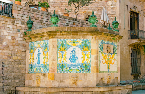 Historical architecture buildings with typical azulejos tile patterns in the old town of Barcelona, Spain 