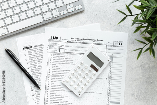 US tax form on office table desktop. Accountant culculate taxes