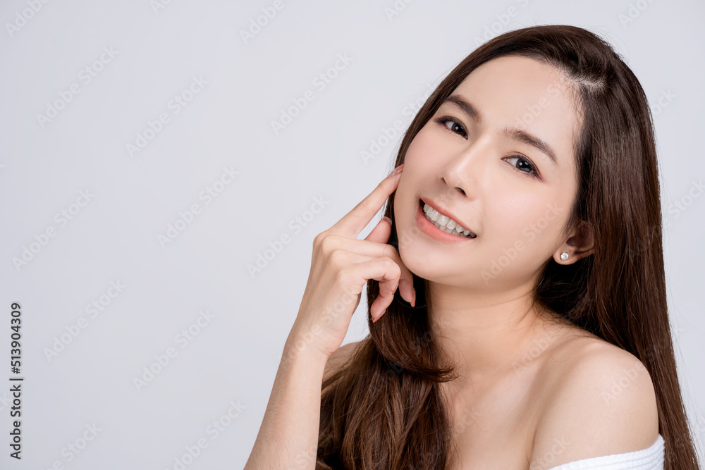 Beautiful female asian face with natural perfect skin in studio portrait. Face care, Facial treatment, Cosmetology, beauty and spa. Beautiful female asian face with natural perfect skin in studio portrait. Face care, Facial treatment, Cosmetology, beauty and spa.