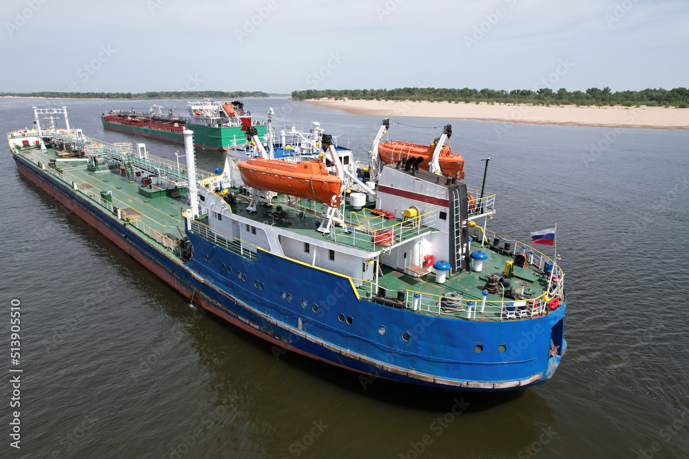 Marine tankers on the roads of the Volga river transport oil products to Europe. Cargo transportation of oil products. Russia