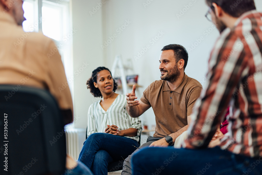 © bnenin - An adult man leads the main word, talking about mental health. © bnenin - An adult man leads the main word, talking about mental health.