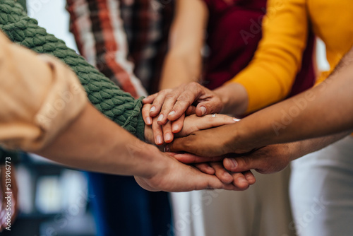 Close up of hands, people holding hands together, finished a meeting.