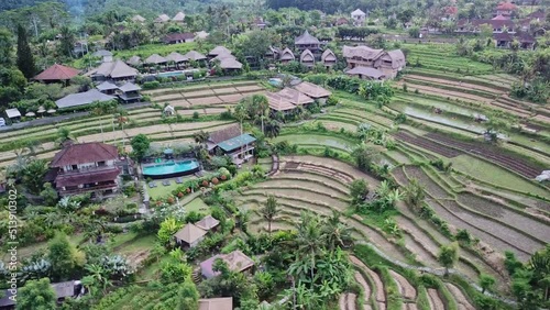 Luxury hotel with straw roof villas and pools in the heart of rice terraces in Bali. Village Ubud in Bali, Indonesia