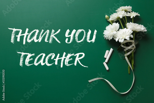 Phrase Thank You Teacher, beautiful flowers and chalk on green chalkboard, flat lay