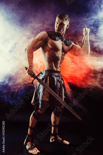 Antique warrior with sword against background with smoke © zamuruev