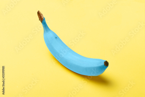 Blue java banana on pastel yellow background