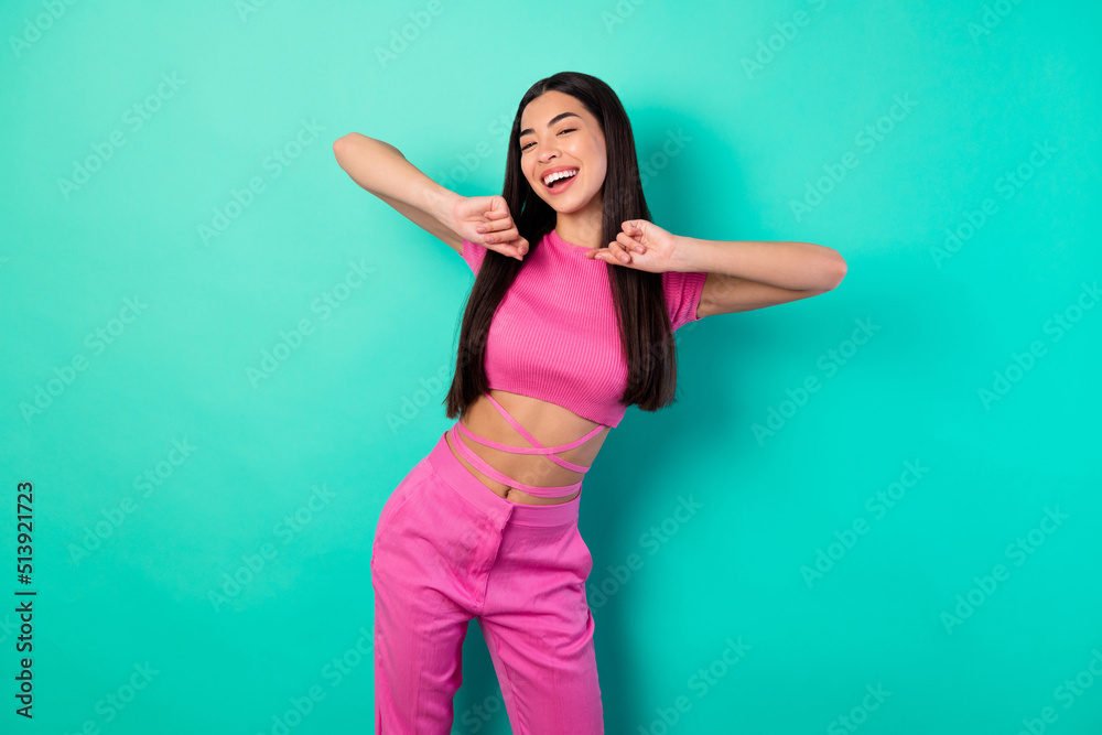 Leinwandbild Motiv - deagreez : Photo of adorable female in trendy set of clothes feel free dancing in club isolated on teal color background