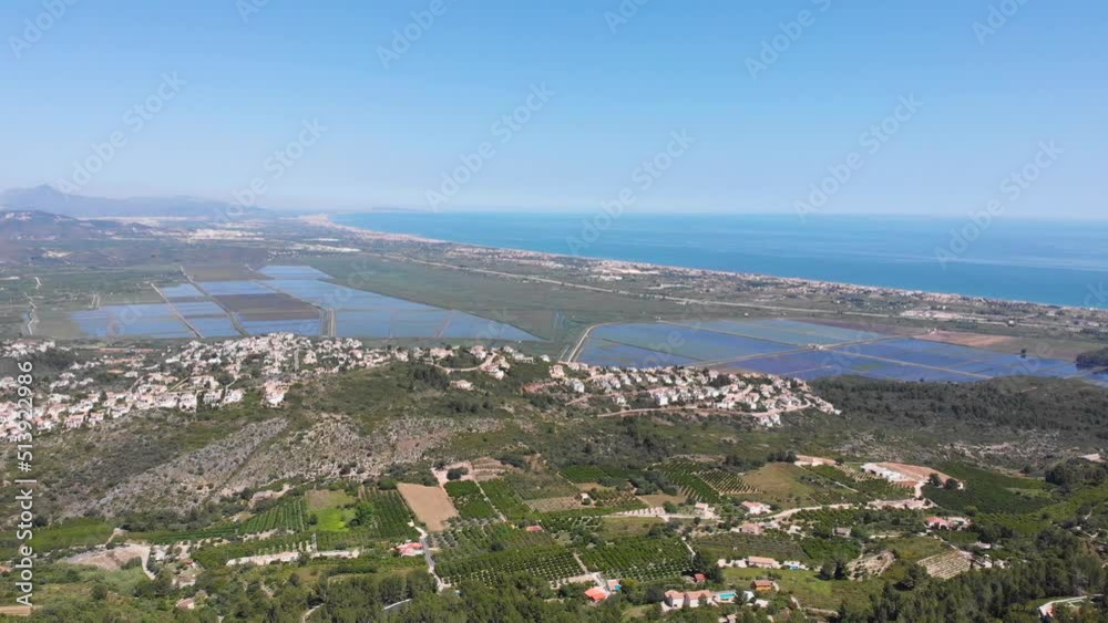 Aerial view of Marjal wetlands nature park in Pego and Oliva, Spain. View from Segaria Mountain. The Mediterranean sea is in the background. Aerial view of Marjal wetlands nature park in Pego and Oliva, Spain. View from Segaria Mountain. The Mediterranean sea is in the background.