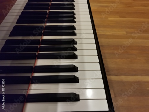 piano keyboard and black stripe with copy space. music writing background concept