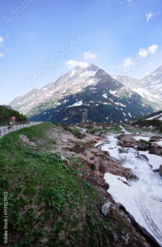 Travel by Switzerland. Beautiful summer Alpine mountains landscape with snow.
