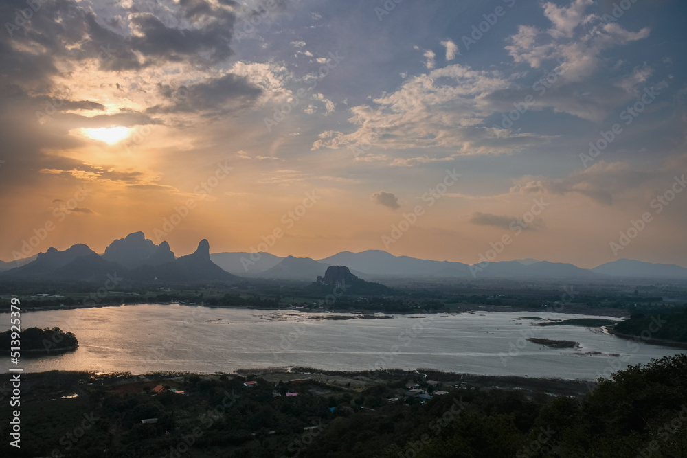 Phu Sub Lek is hidden gem of Lopburi, Thailand to see view of Khao Jeen Lae with unseen sunset sky over the water from lake.