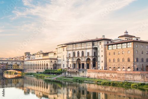 Beautiful view of the Uffizi Gallery on the banks of the Arno River in Florence, Italy photo