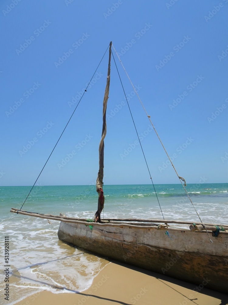 Fototapeta premium The wooden boat on the water's edge(Morondava, Madagascar)