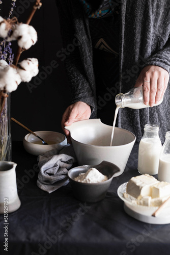 Pouring milk on bowl photo