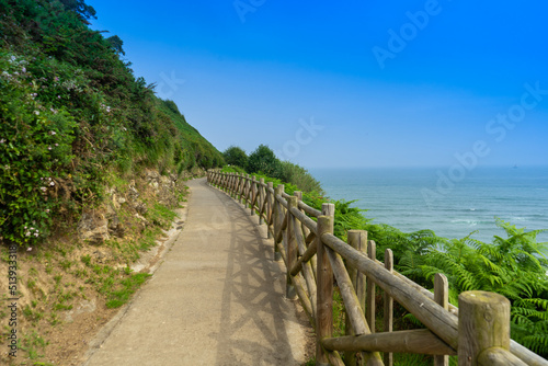 Hiking trail along the rocks and the ocean. Way of the Camino de Santiago © Pavel