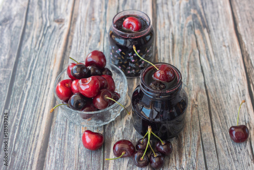 Jars with fresh homemade cherry jam