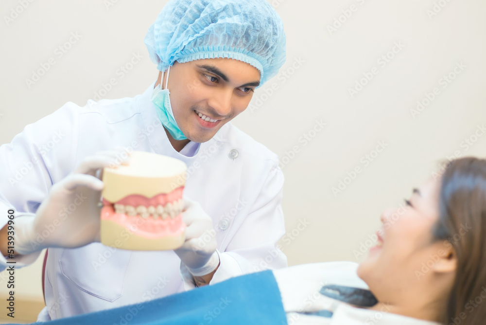 Dentists examining patients lying in chair in a dental clinic. Dentists examining patients lying in chair in a dental clinic.