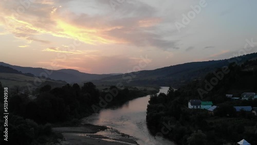 river in the mountains at sunset