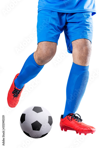 Football player man in a blue jersey kicking the ball