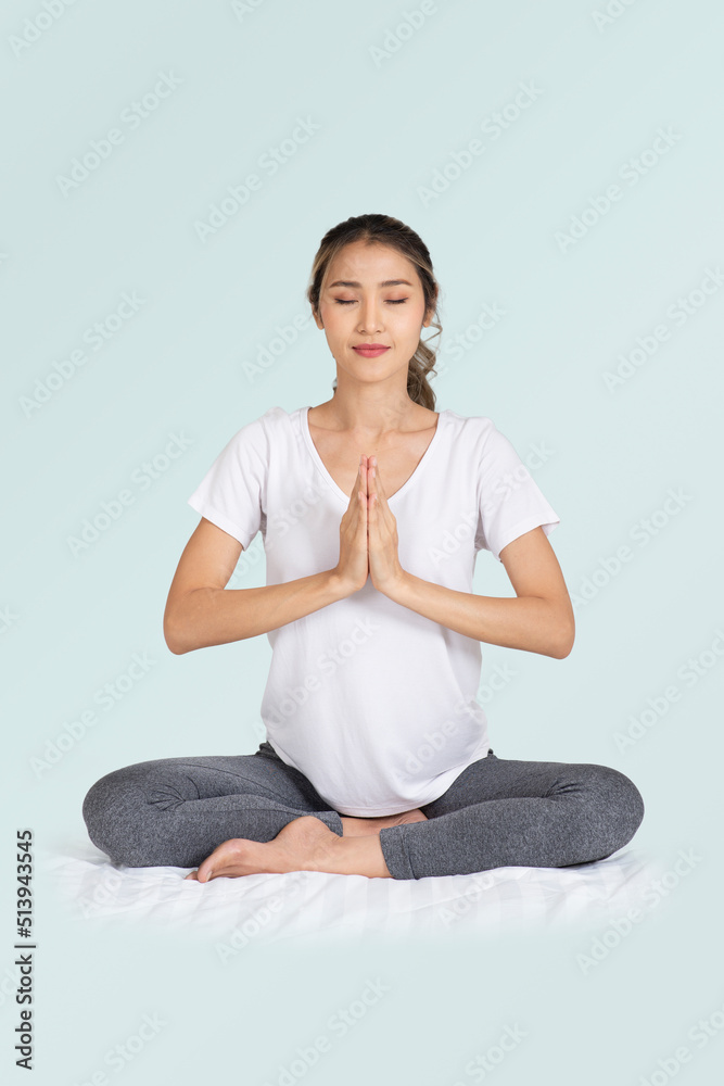 Woman eye closed and sitting on floor put her hands together to doing meditation. Woman eye closed and sitting on floor put her hands together to doing meditation.