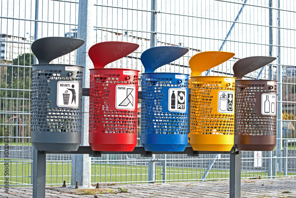 Color coded trash cans for different kinds of waste including