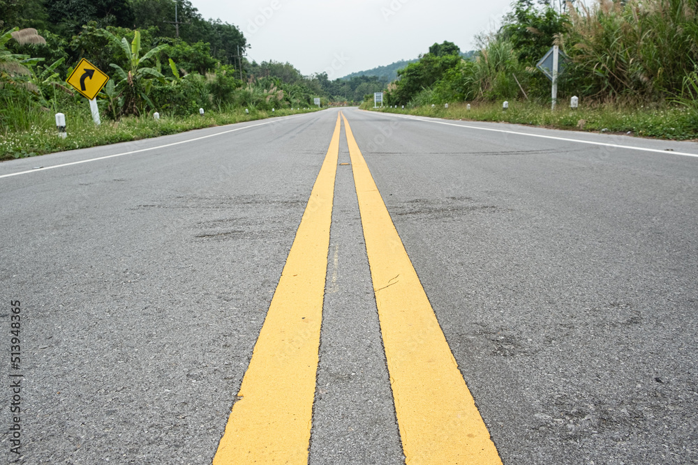 Obraz premium The yellow line divides the route.selective focus