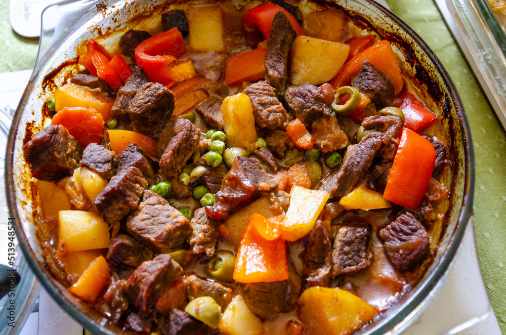 Beef Kaldereta is a Filipino stew or casserole made with beef, potatoes, carrots, peas and olives cooked all together in one pot.