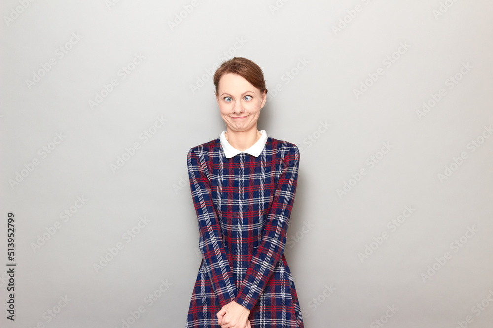 Portrait of funny confused young woman making silly goofy face Portrait of funny confused young woman making silly goofy face