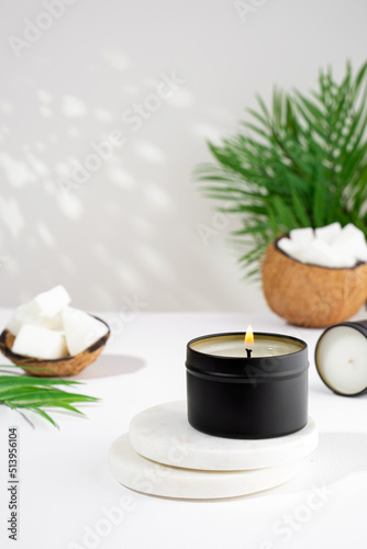 Coconut wax candle in a black jar on a white background. natural eco friendly coconut wax candles. Trendy concept. minimalist. isometric projection. copy space.