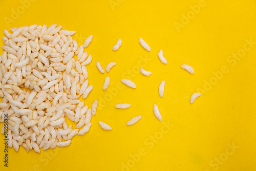 Puffed rice, Churmure or murmure or moori. Traditional food isolated on yellow background