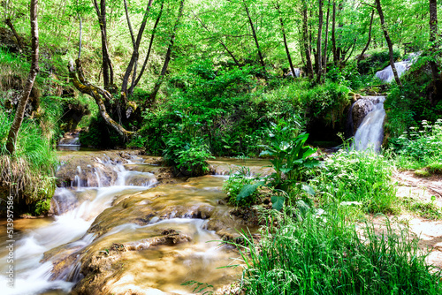 Mountain stream with small waterfalls. Katusnica river and Gostilje waterfalls, Mountain Zlatoibor, Western Serbia photo