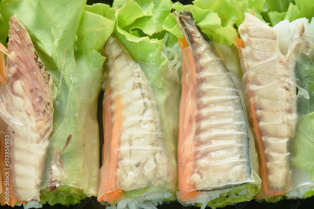 roll flour stuffed mackerel fish and vegetable dipping with spicy chili sauce on plate roll flour stuffed mackerel fish and vegetable dipping with spicy chili sauce on plate