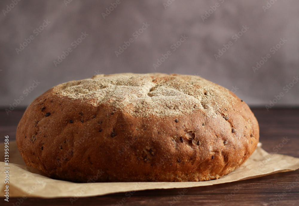 round buckwheat bread on a wooden background