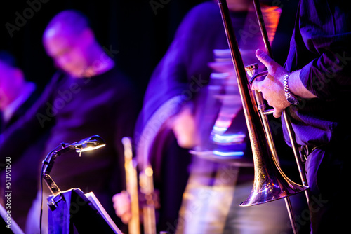 Big Band: blurred blues. Foreground focus with movement in the blurred background players. From a series of images of musicians in a swing Jazz band. photo