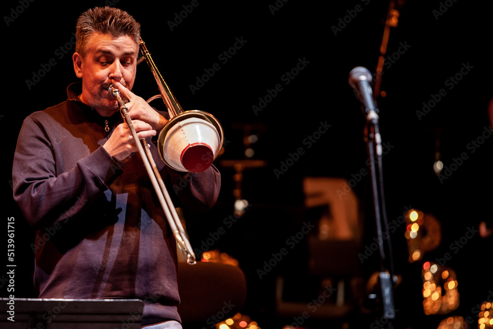 Fototapeta premium Big Band: muted trombone solo. From a series of images of musicians in a swing Jazz band.