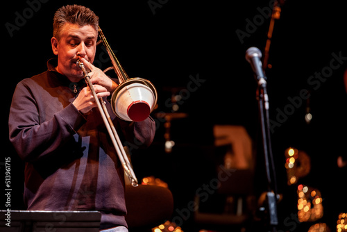 Big Band: muted trombone solo. From a series of images of musicians in a swing Jazz band.