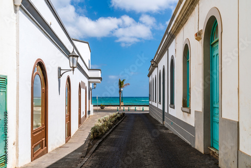 Traditional street with whitewashed houses and colorful windows and doors in Arrecife, Lanzarote, Canary Islands, Spain photo