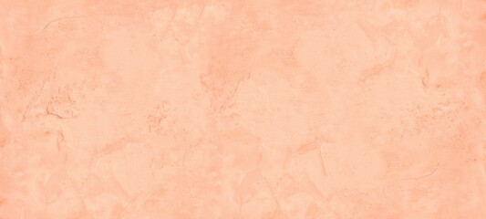 Pastel peach color painted old rough cement plaster widescreen texture. Aged exterior wall light orange wide background