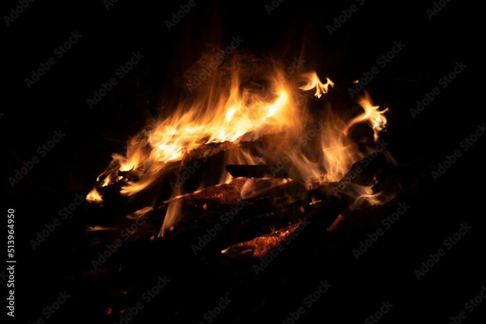 Bonfire in dark. Flames at night. Burning wood. Camping details. Bonfire in dark. Flames at night. Burning wood. Camping details.