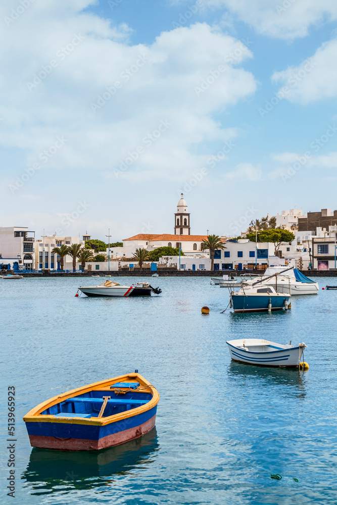 Arrecife quay with historic architecture and boats on blue water, Lanzarote, Canary Islands, Spain