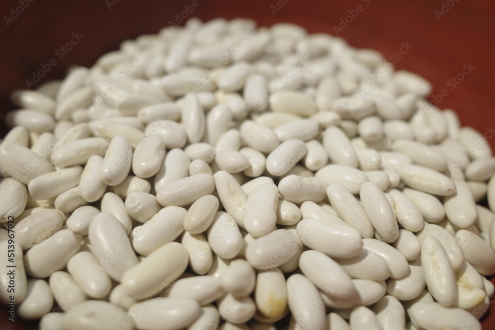 white beans on a red background white beans on a red background