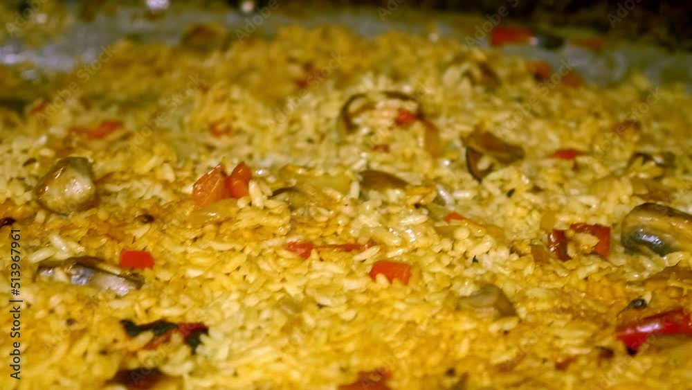 detailed closeup shot of a Valencian yellow rice paella with all its