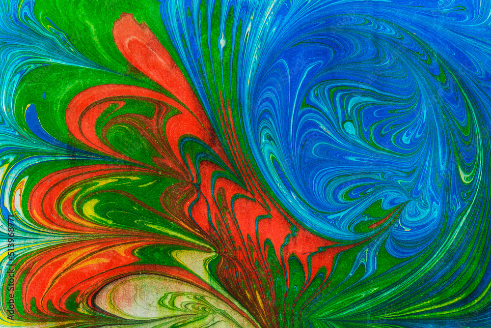 Abstract multicolored drawing with paints on the water.