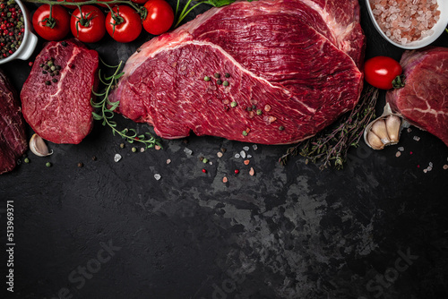 Canvas Print Beef tenderloin fillet with rosemary and spices on a dark background