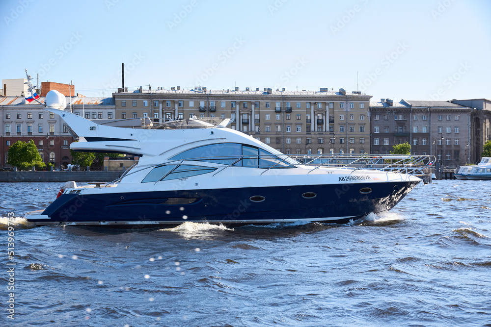 Obraz premium Photo of a yacht sailing on the river