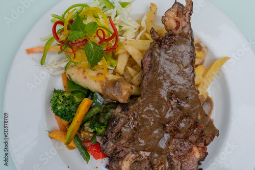 juicy bbq rib steak with garlic mashed potatoes and brocolli photo