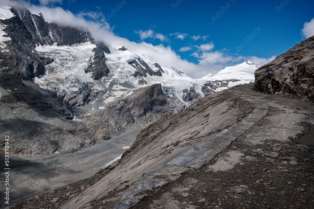 Fototapeta premium Mountain landscape with snow-capped peaks and blue sky