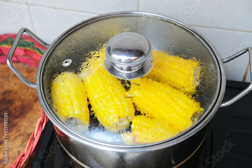 Sweet corn boiled inside a pan photo