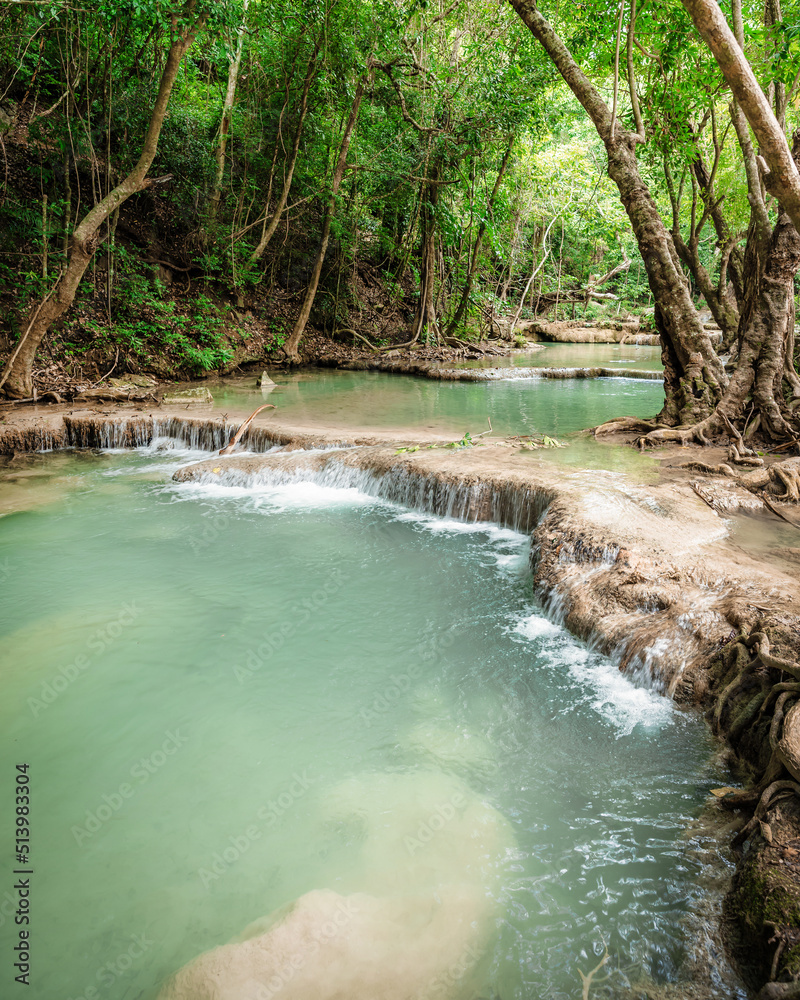Obraz premium beautiful emerald waterfalls green forest mountains guiding for backpacker Thailand destinations backpacking camping relaxing hiking at Erawan waterfall national park, Sinakharin Dam, Kanchanaburi.