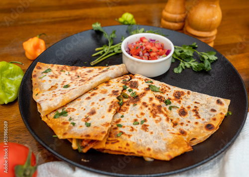 Homemade Indian vegetarian food- allo paratha served with potato curry and bowl of curd, traditional cuisine.